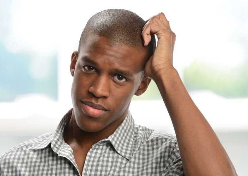 A confused young man making mistakes