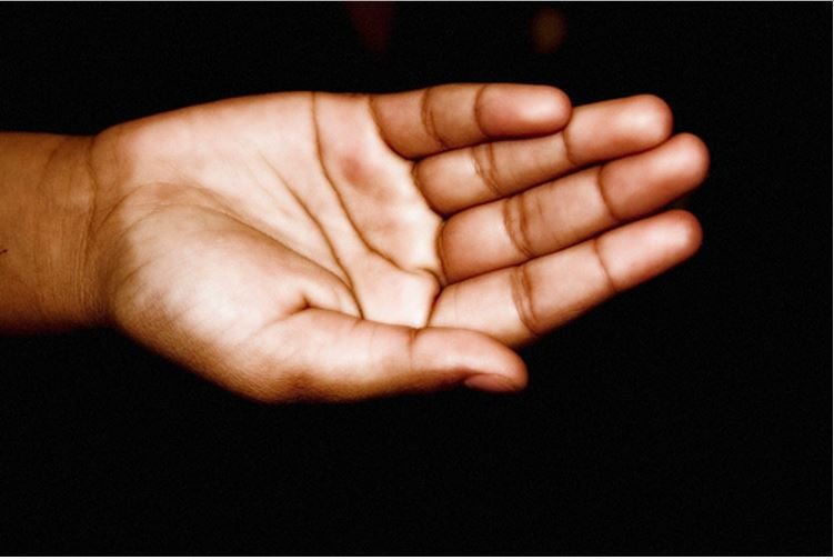 hands held open in the dark