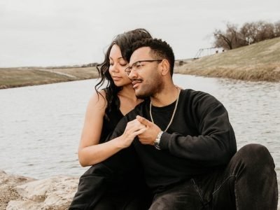 couple enjoying intimacy beside lake