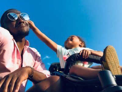 dad playing with his son outdoors