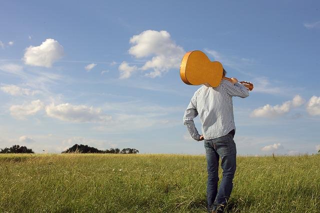 man going to party on field without friends