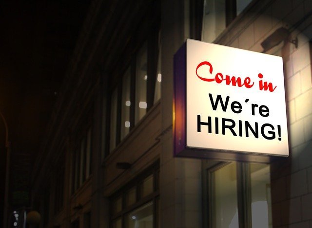 notive of job offer - billboard displaying notice we're hiring