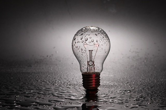 light bulb on a rainy night showing the need to ignite your idea