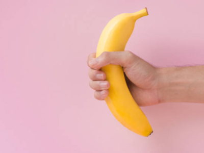 man holding a banana