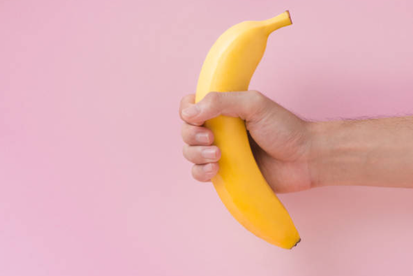 man holding a banana