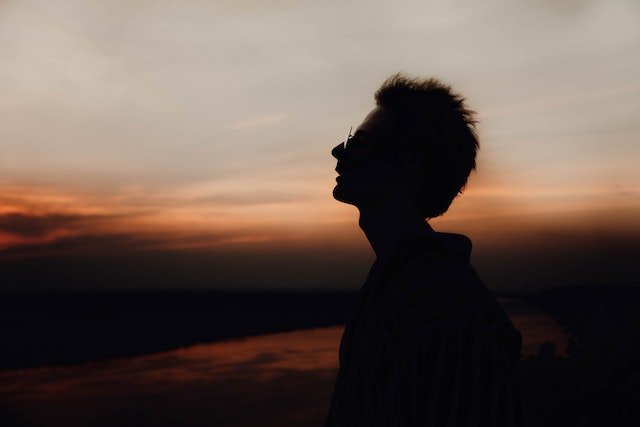 silhouette of man with emotional maturity in evening sky