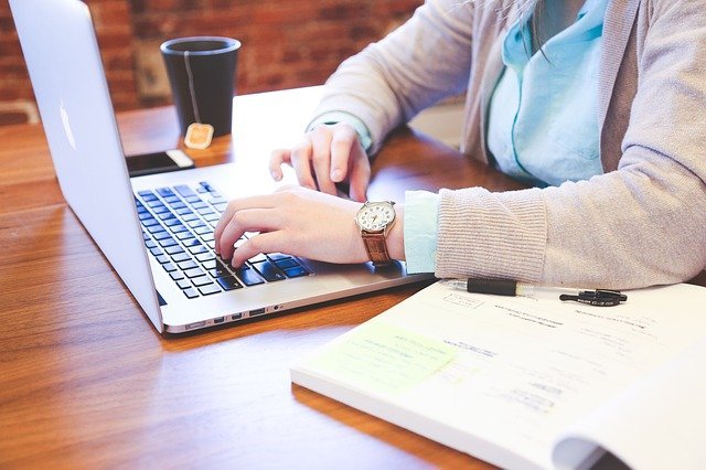 woman with in-demand skills working on laptop using