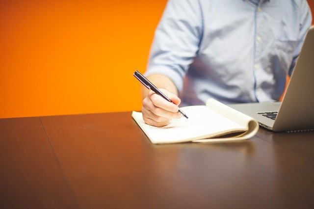 entrepreneur following business succes tips at desk