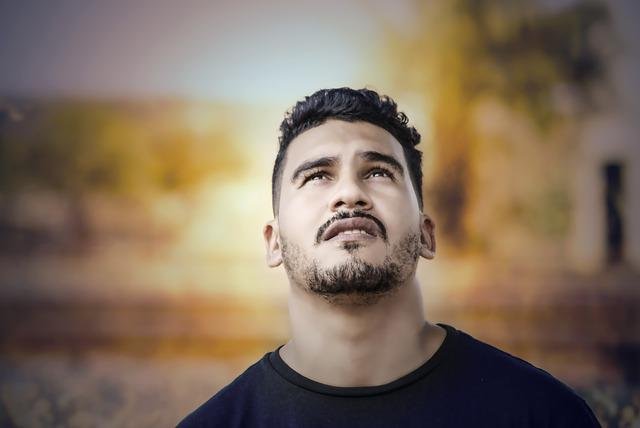 good man staring at the sky