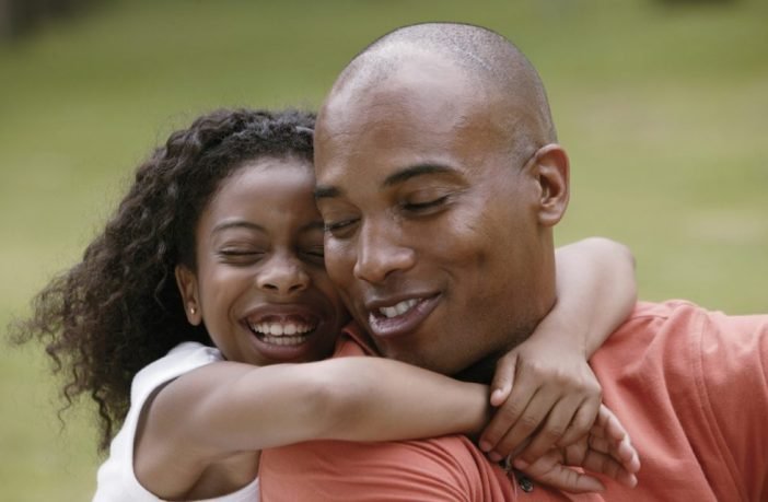 man having fun with his daughter