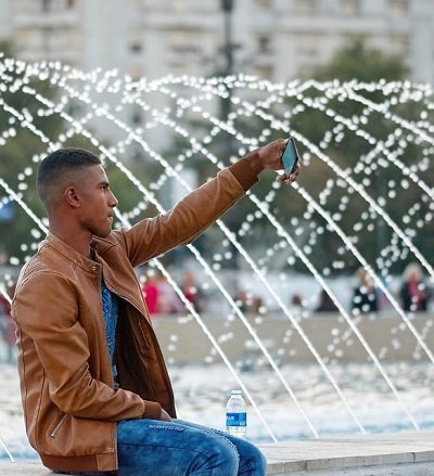 boy with phone facing social media distractions