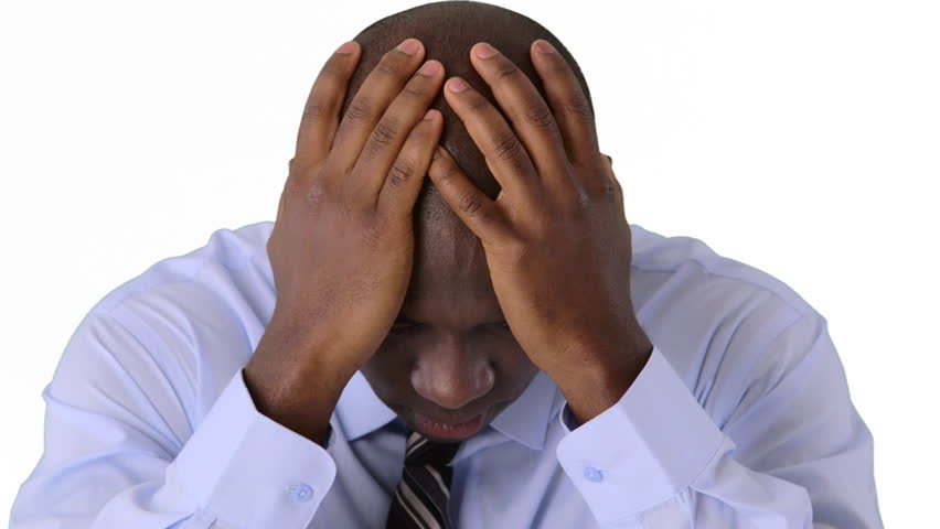 man getting intrusive thoughts and holding his head