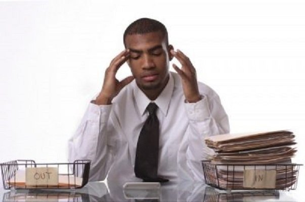 workaholic holding his head