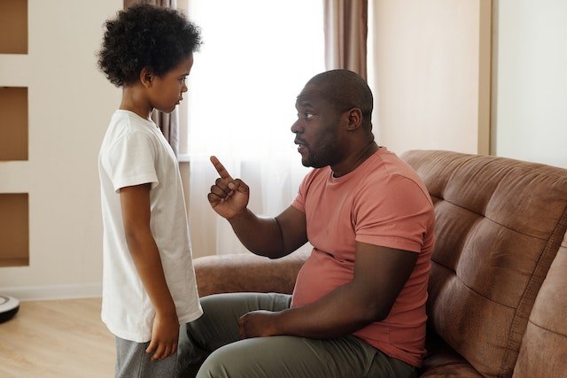 Man trying to say something to a child