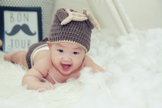 babies on white bed
