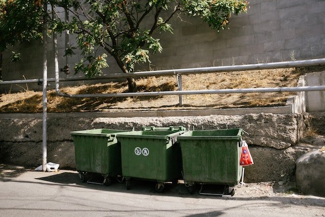 Green Garbage Waste Bin on the Roadside