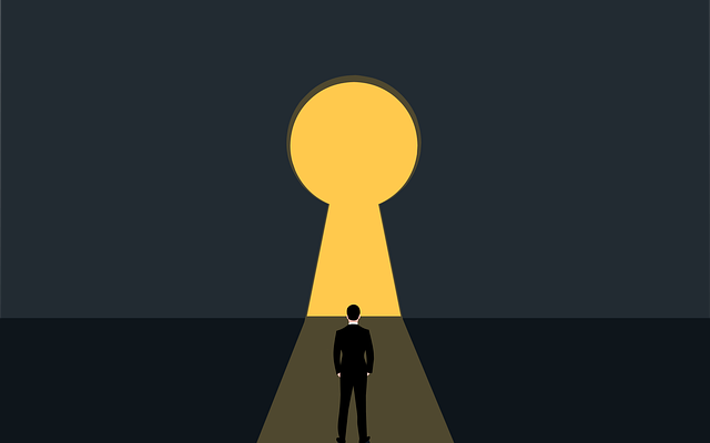 determined man facing large yellow key hole