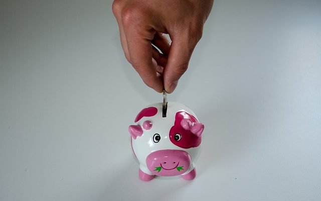 man saving in piggybank for his retirement