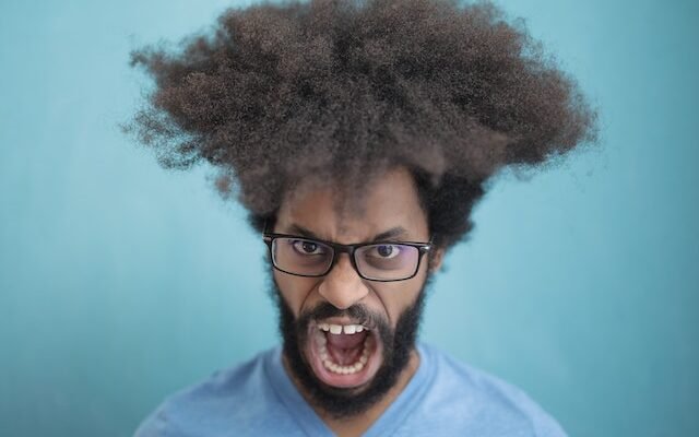 man screaming and displaying toxic masculinity